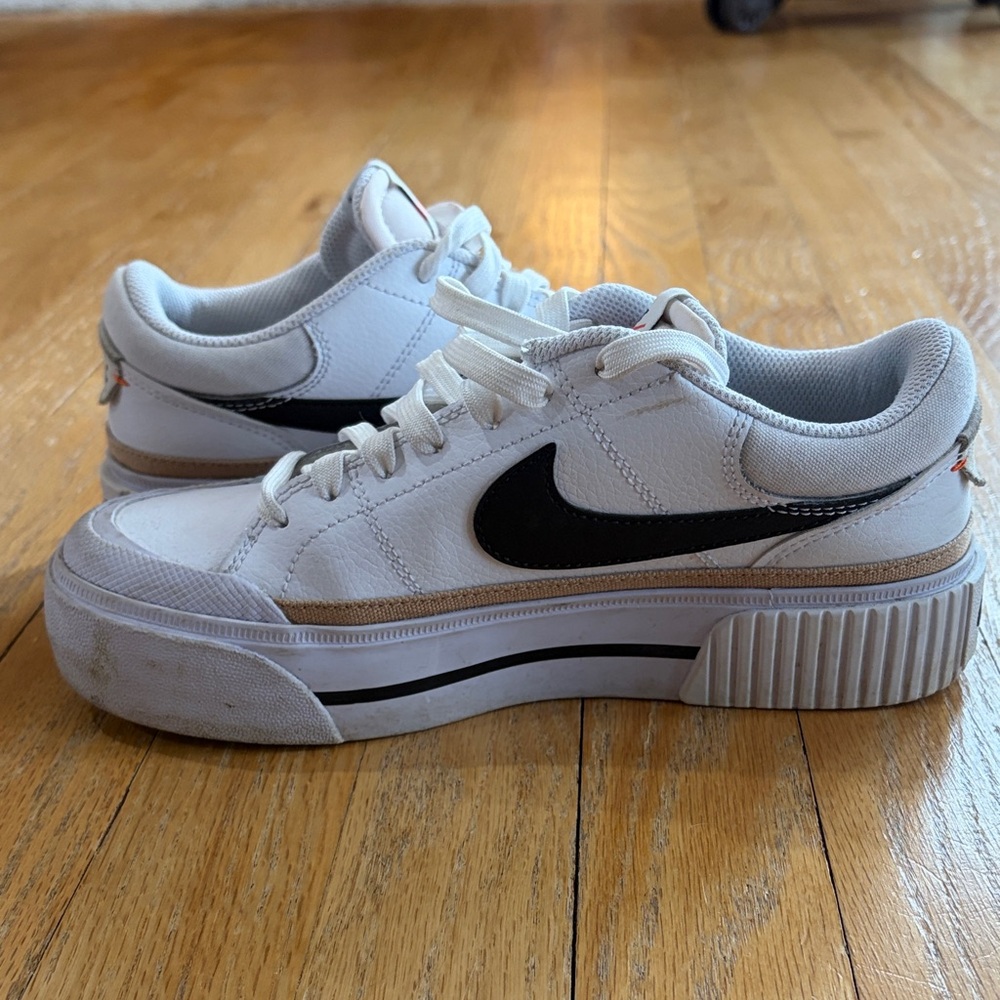 Nike White Low-Top Sneakers with Black Swoosh and Gold Accent - Picture 12 of 15